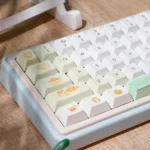 Whimsical Summer Orange Cat PBT Keycap Set, displaying multiple angles of the playful orange cat designs and soft summer pastel hues.