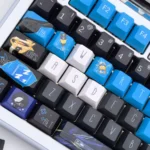 Detailed gallery views of the exclusive Overwatch Ana keycap set, showcasing its intricate Vigilant Spirit design, iconic elements, and premium finish.