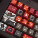 Detailed view of the handcrafted Overwatch Cassidy keycap set, highlighting iconic character elements and its rugged Western aesthetic from a top-down perspective view.