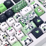 Exquisite handcrafted panda artisan keycap set. Whimsical miniature panda sculpture, meticulously crafted, showcasing its iconic black and white charm design.