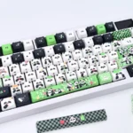 An exquisite handcrafted panda artisan keycap set, a whimsical miniature panda sculpture, bringing iconic black and white charm to a mechanical keyboard.