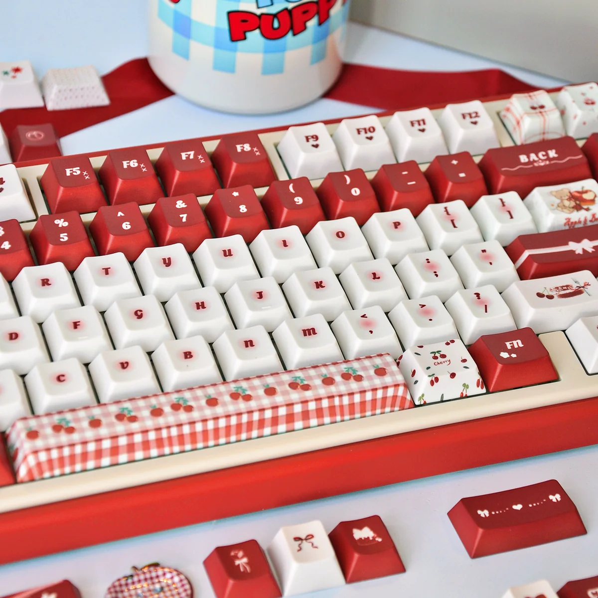 Vibrant Cherry Day PBT dye-sub keycap set showcasing its cheerful red and white design, Cherry profile, and whimsical cherry legends from various angles.