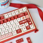 Vibrant PBT Dye-Sub Cherry Profile keycaps set from the Cherry Day set, showcased from various angles with cheerful red and white cherry legends.