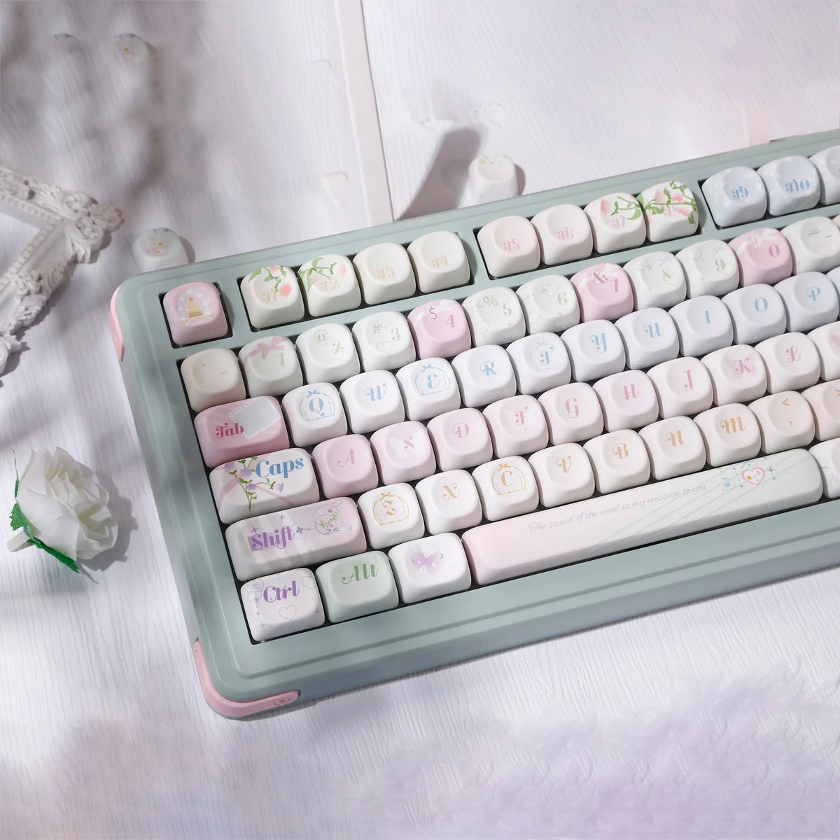 Wind Chime Dream PBT Keycap Set detail, showing durable PBT and ethereal blue-pink gradient. Artistic whimsical wind chime and cloud motifs.