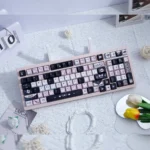 Gallery view of enigmatic black and vibrant pink artistic PBT keycaps set, showcasing their unique dye-sub legends and premium finish from multiple angles.