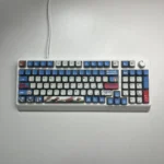 Vibrant RGB PBT MyGO Band Theme keycap set in a playful display, showcasing their immersive glow and comfortable MDA profile on a modern keyboard.