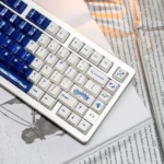 Close-up of Luminous Acid Blue White PC keycaps set, showcasing their striking translucent blue and opaque white contrast from a unique angle.