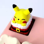 Festive, handcrafted 3D resin Pikachu keycap, sculpted with playful charm. Displayed from various angles for keyboards.