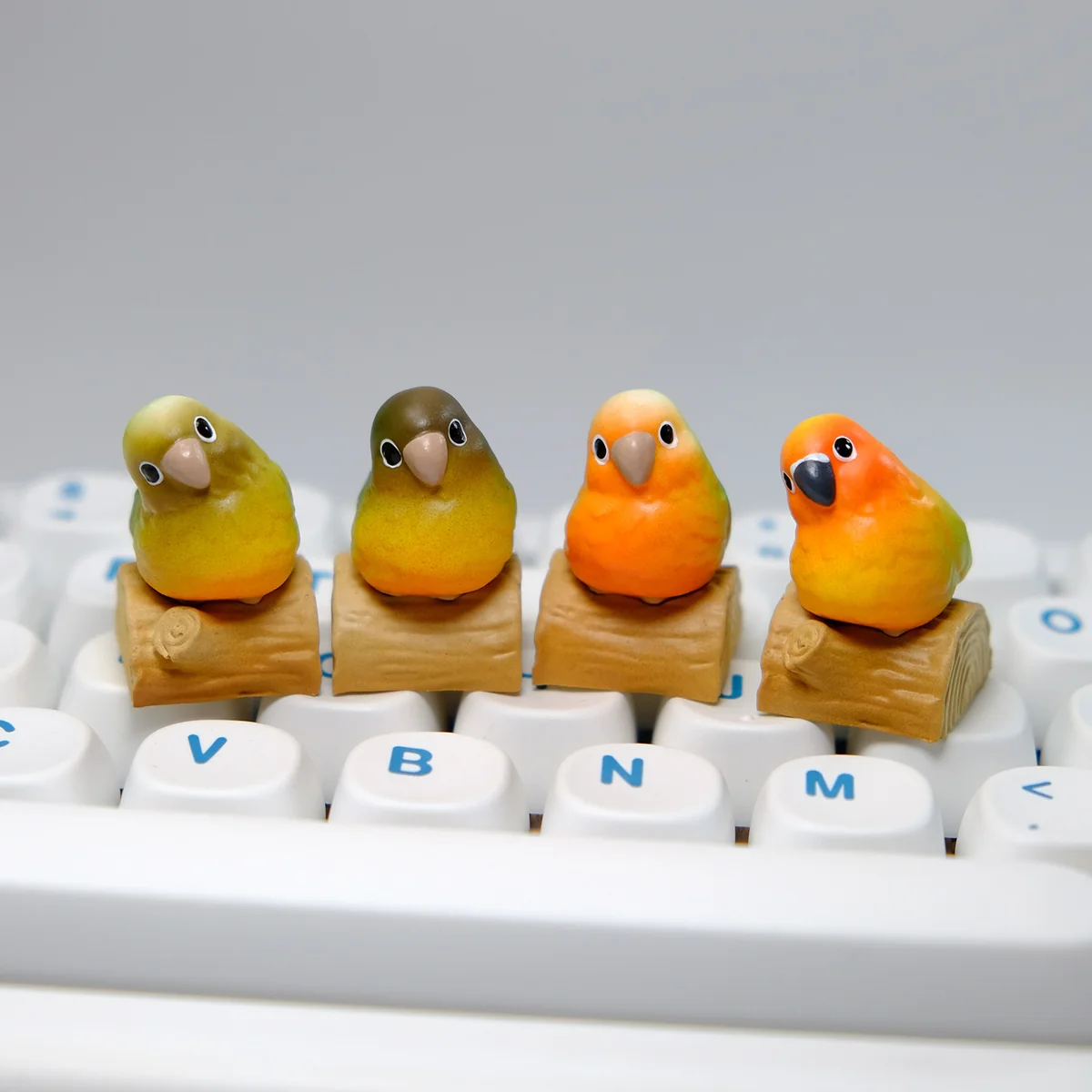 Handmade Pineapple Conure Keycaps, a vibrant miniature tropical scene on a rustic base.