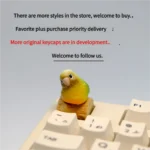 Vibrant handmade 3D Pineapple Conure Keycaps, showing its intricate tropical scene on a rustic base from a side view.