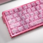 A gallery view of Pink Forged Carbon Keycaps set from various angles, showcasing their distinctive, high-tech texture and vibrant pink elegance.