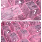 Premium pink forged carbon PC keycaps set, a small full set with side-engraved legends, highlighting their distinctive texture and playful elegance.