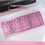 Vibrant pink forged carbon keycaps set featuring their distinctive high-tech texture, blending playful elegance with premium craftsmanship.
