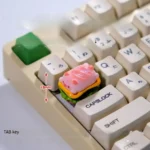 Whimsical pink pig pie handcrafted 3D artisan keycap, showcasing its glossy finish and intricate sculpted details.