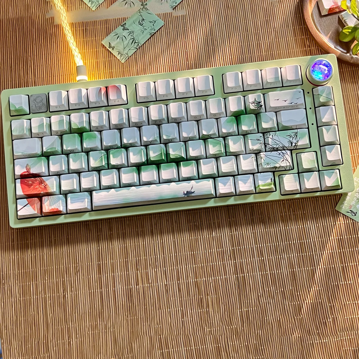 Poetic Chinese Landscape PBT Keycap Set displaying serene ink wash art and traditional motifs. This artistic Chinese keycap set offers deep, poetic desaign.