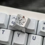 Detailed view of a premium Charmander Titanium Pokemon artisan keycap, highlighting its vibrant metallic finish and intricate, handcrafted details.