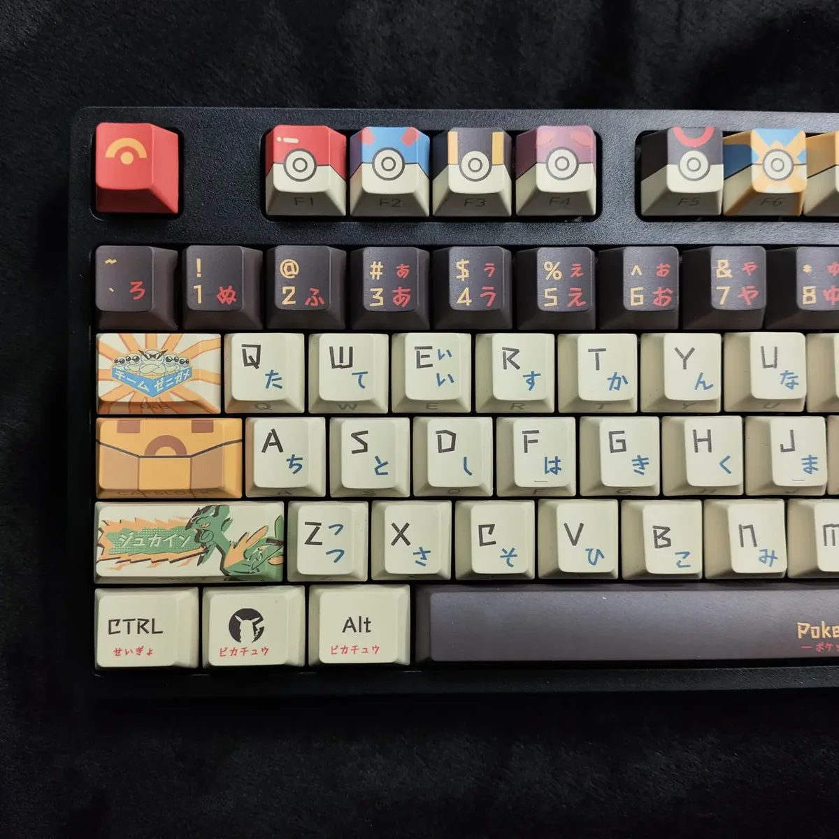 A gallery of durable PBT Pokemon side-legend keycaps set, showcasing iconic characters and their clean, minimalist design from various angles.