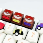 Relive childhood with this vibrant 3D Pokemon Poke Ball keycap, showcasing its iconic sculpted design from various angles, a premium collectible.