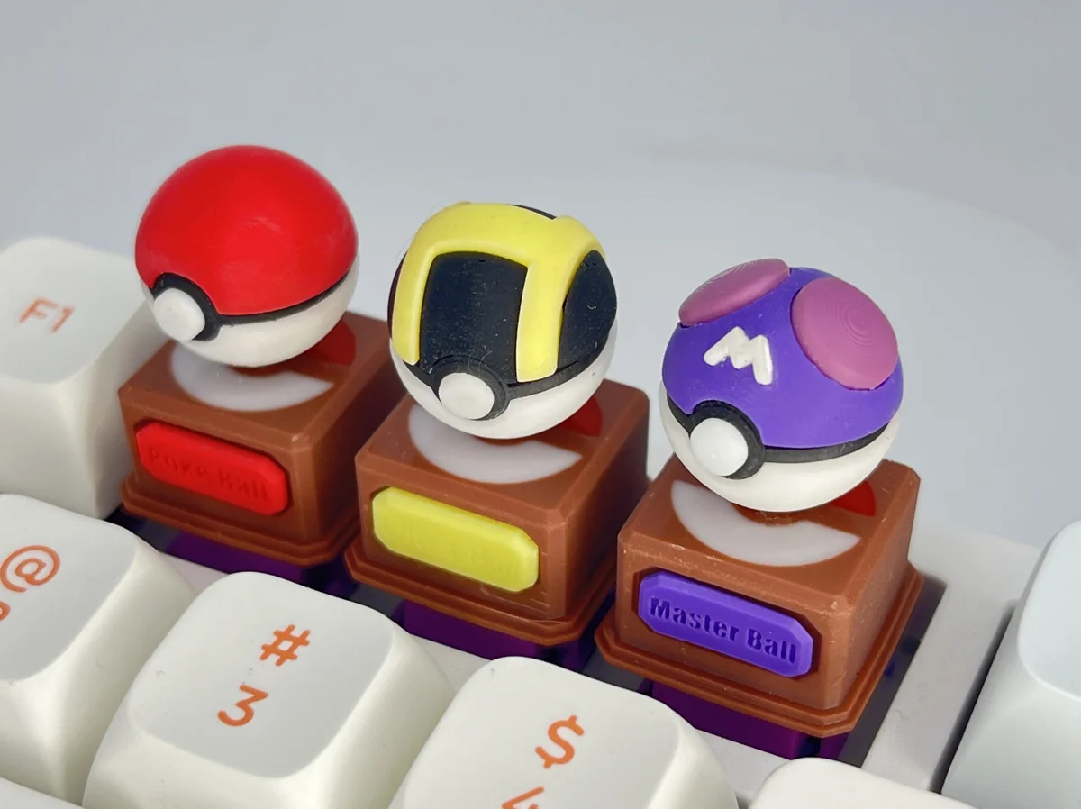 A vibrant 3D Pokemon Poke Ball keycap, featuring its iconic sculpted design. Relive childhood with this premium keyboard accessory.