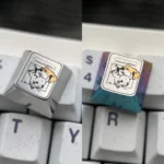 Close-up of a premium Pikachu Pokemon titanium keycap, an artisan ESC key, showcasing vibrant colors and sleek metallic craftsmanship.