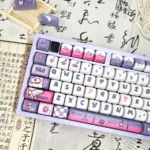 A gallery of whimsical Rabbit Nurse PBT keycaps set shown from various angles, highlighting the adorable character designs and soft, playful aesthetics.