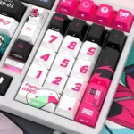 Racing Miku keycaps set on a keyboard, with vibrant side-lit PBT legends glowing, embodying the playful anime racing theme.
