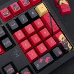 Exclusive Red Robin Vigilante keycap set close-up. Striking red and black DC tribute design, highlighting the premium heroic comic book aesthetic and art.