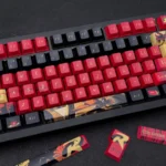 Striking Red Robin Vigilante keycaps set showcasing iconic DC motifs in a premium red and black design for mechanical keyboards.