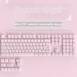 Exquisite Rococo Angel pearlescent PBT keycap set from multiple angles, revealing its ethereal design, delicate pastel hues, and shimmering finish.