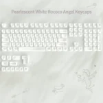 Artistic close-up of an exquisite ethereal Rococo angel keycap set in shimmering pearlescent white, highlighting its delicate ornate details.