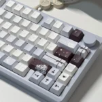 Artistic PBT Romance and Poetry Cherry Keycap Set, dye-sublimated with soft, poetic patterns. Subtle, romantic colors are visible from multiple angles.