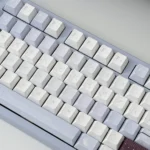 Close-up of artistic Romance and Poetry Cherry Keycap Set, showcasing dye-sublimated soft patterns and subtle colors from various angles.