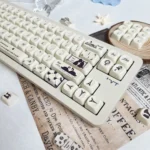 Encounter Romantic Series Keycap Set. Durable PBT, dye-sub, soft pastels, delicate romantic illustrations, elegant legends, shown from various angles.