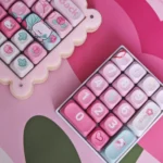 Charming Pink Rose Bunny PBT keycaps set from the Garden Set, showcasing intricate rabbit and rose designs in soft pastel pink from a unique angle.