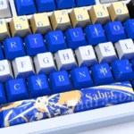 Gleaming Saber Excalibur metallic coating PBT dye-sub keycaps set, artfully displayed to highlight their intricate Saber-themed design and premium finish.