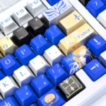 A detailed view of the exclusive Saber-themed metallic coating PBT dye-sub keycaps set, highlighting the elegant Excalibur design and premium texture.