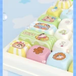 Close-up view of the playful Shin-chan PBT dye-sub keycap set, showcasing vibrant cartoon characters from various angles with crisp, durable details.