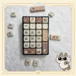 Adorable Siamese cat PBT keycaps set from multiple angles, showcasing the unique dye-sub illustrations and durable PBT material with warm, soft colors.