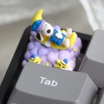 Handcrafted Snoopy Moon artisan resin keycap featuring whimsical Snoopy playfully perched on a dreamy crescent moon, a celestial art piece.