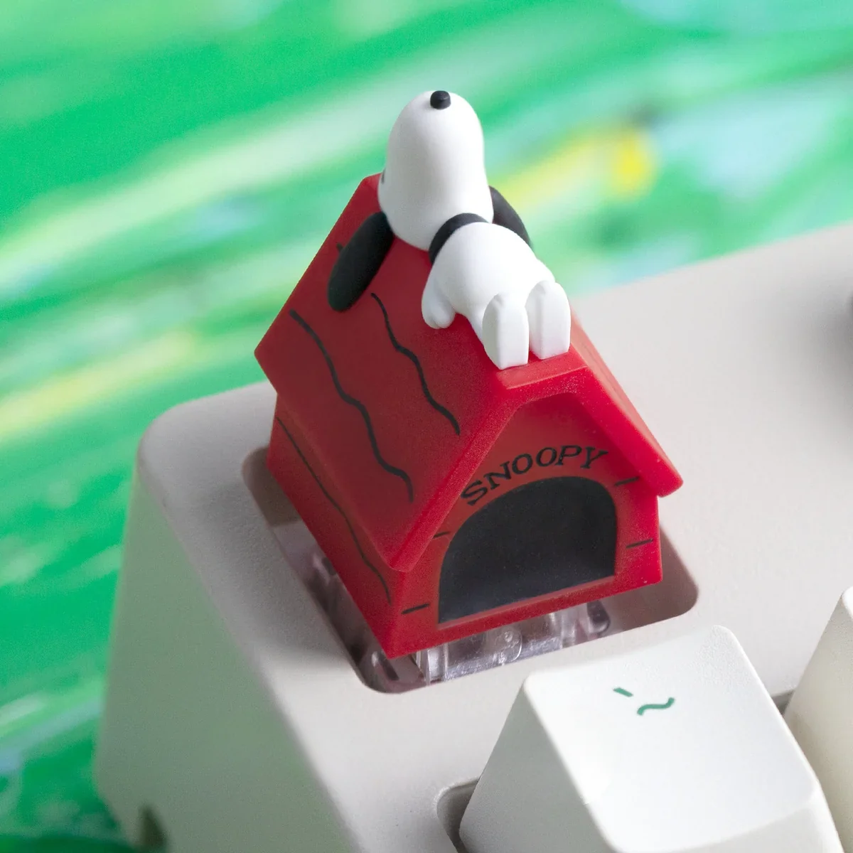 A collection of handcrafted Snoopy resin ESC keycaps from various angles, showcasing the vibrant, detailed artistic design and whimsical charm.