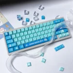 Exclusive Snow Hatsune Miku PBT Dye-Sub Keycaps Set showcasing a beautiful icy blue, white, and purple Winter Dream design with detailed character art and snowfla