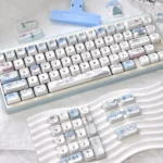 Whimsical snowman mechanical keycaps, showcasing a charming blue and white winter wonderland with playful snowmen and snowflakes.