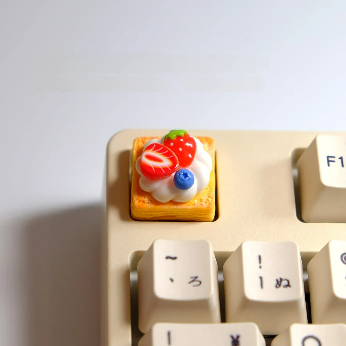 Handmade hyper-realistic Strawberry Mille-Feuille Artisan Keycap, showcasing vibrant pink and cream layers, perfect dessert art for keyboards.