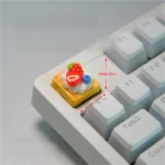 Handmade strawberry mille-feuille artisan keycap featuring vibrant red and cream layers, a hyper-realistic dessert art piece.