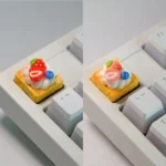 Handmade strawberry mille-feuille artisan keycap, a hyper-realistic dessert art piece with vibrant pink and cream layers.