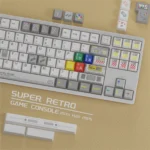 Multiple views of durable PBT Super Retro keycaps set, showcasing vibrant dye-sub pixel art and iconic retro gaming characters. A premium nostalgic set.
