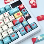 Exclusive DC Superman keycaps full set, showcased from multiple angles highlighting the iconic red and blue design and heroic emblem for a premium collectible setup.