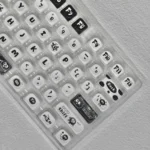 Ghibli Susuwatari PBT Dye-sub Keycaps set from various angles. High-quality keycaps with enchanting dark characters, evoking playful nostalgic design.