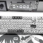 Whimsical Ghibli Susuwatari PBT dye-sub keycaps set. Multiple angles highlight playful characters, durable PBT, and vibrant dye-sub quality, evoking purely design.