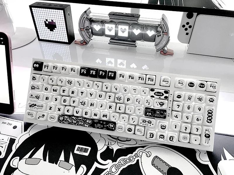 Whimsical Susuwatari PBT Dye-sub keycaps set displayed on a minimalist background, showcasing the enchanting and playful characters.